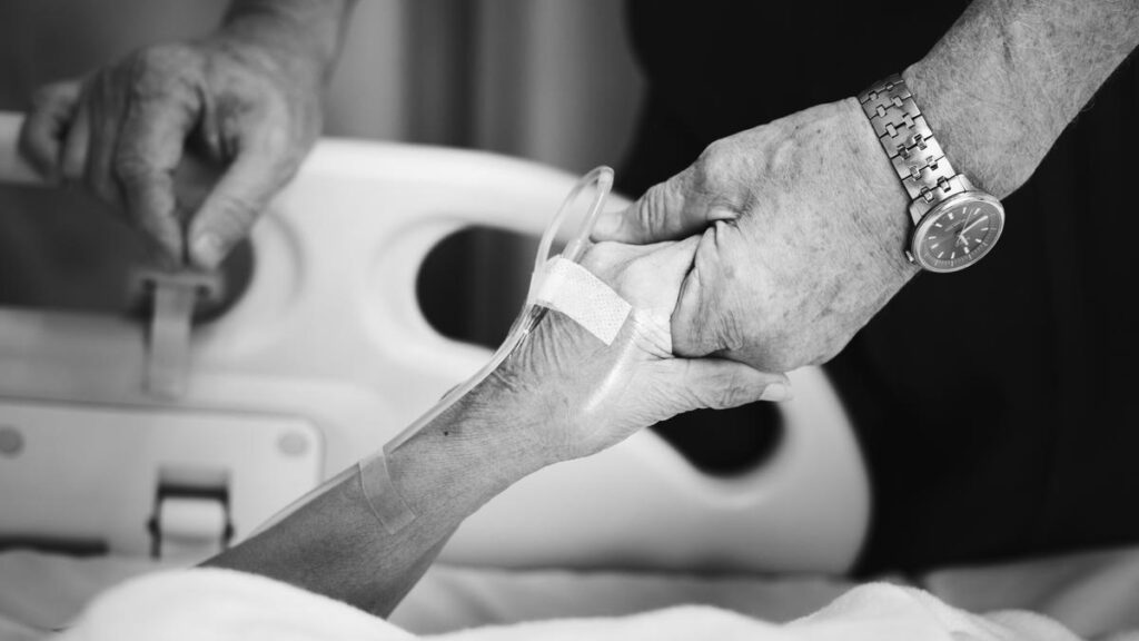 husband-holding-hand-with-his-wife-hospital.jpg